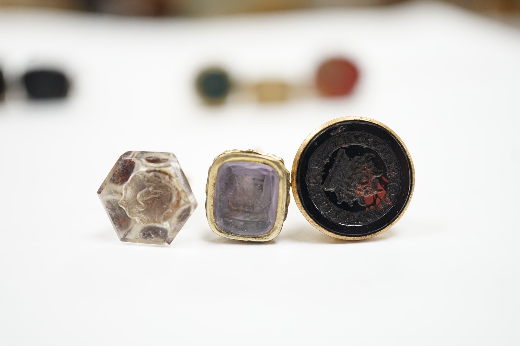 A collection of twelve small 19th century mainly yellow metal fob seals, with assorted matrices including bloodstone, amethyst, citrine and carnelian, largest 22mm.
